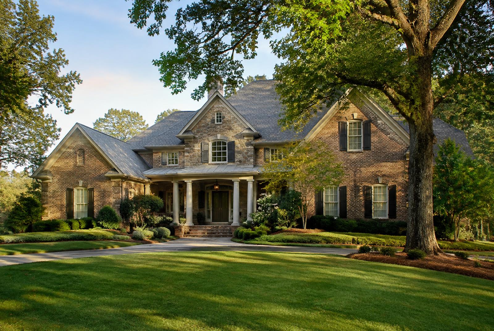 A traditional brick and stone estate home of the style found in Firethorne, Waxhaw NC